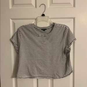 White crop top with thin black stripes.